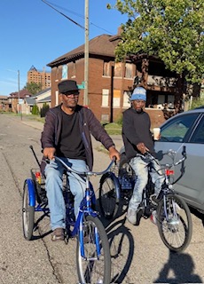 Two cyclists on a residential street in Northwest Goldberg, Detroit